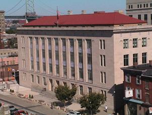 Federal Courthouse in Camden, which is connected to Philadelphia via the Benjamin Franklin Bridge in the background