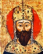 Drawing of an emperor from chest up. He has a dark beard, brown eyes, light skin, and jeweled regalia.