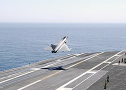 A French navy Rafale F-3 fighter aircraft launches from the Nimitz-class aircraft carrier USS Harry S. Truman (CVN 75)