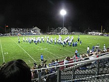 A huge light pointed toward a football field