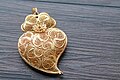 Image 47Typical Portuguese filigree heart shaped pendant, an iconic item in Portuguese fashion and design. (from Culture of Portugal)