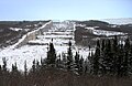 De enorme noodoverlaat van het Robert Bourassastuwmeer in de rivier de La Grande, Quebec