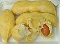 Pack of durian showing segments and stone