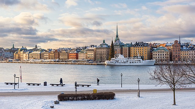 Skeppsbrokajen in Stockholm as seen from Skeppsholmen, Stadsholmen (Gamla Stan) behind it.