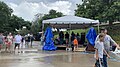 Atendees of the 25th Natchitoches Jazz and R&B Festival walk around after brief rain.