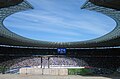 Regular football league game (2007), filled stadium. In front the bowl for the olympic flame during the summer olympics in 1936