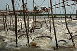 Fishing weirs using baskets at a river waterfall, Democratic Republic of the Congo