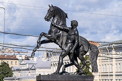 The Horse Tamers, on the Anichkov Bridge, designed by the Russian sculptor, Baron Peter Klodt von Jurgensburg. The silhouettes of the sculptural groups on high pedestals are so expressive that they ensured incredible success for this monument. (photo)