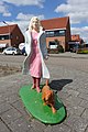 Woman and dog statue