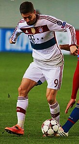 alt=A men's a sociation football player (Robert Lewandowski)