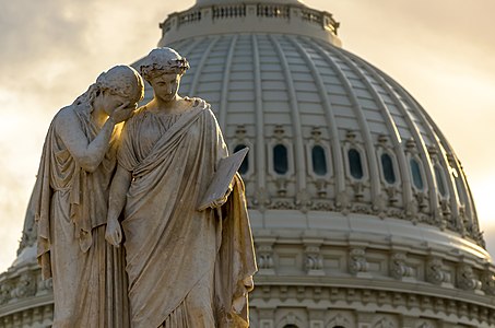 America and History at the top of the monument