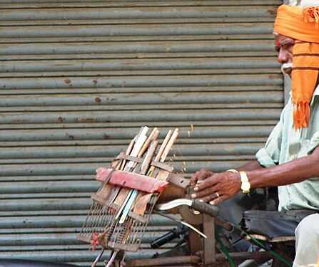 Old knife sharpening man