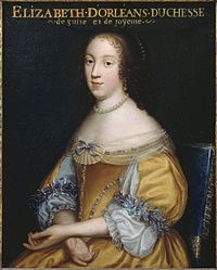 Bust portrait of a young woman, seated. She is wearing a yellow dress with puffy sleeves extending just below her elbow, where it is established with little, faint blue ribbons. Its upper body is embellished with pearls and small black gems. She has her hands crossed in her lap. She is wearing a pearl necklace; her shoulders are relieved by the cut of her dress, on which there is piece of see-through material, arranged in the shape of a shall in the middle, with a small faint blue ribbon on it Her dark, curly hair blends into the black background; she is wearing pearls in it as well as in her ear. She has a low forehead, small eyes, a larger nose, a small mouth, a round chin, and an ova-shaped face.