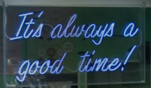 Blue Neon sign in a pastry shop