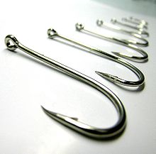 Fishing hooks on white surface.jpg