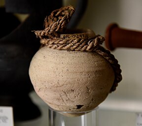 Pottery jar, drab ware. The original loop slip is still present. Ptolemaic period. From Tarkhan (Kafr Ammar), Egypt. The Petrie Museum of Egyptian Archaeology, London