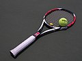 Tennis racket with a ball