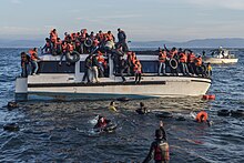 Syrian and Iraqi migrants arriving in Lesbos, Greece, in 2015 seeking refuge.