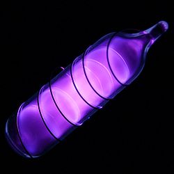 Vial containing a violet glowing gas