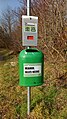 A public waste container with a saying in Traiskirchen, Austria