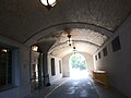 Underneath the stairway and main entrance