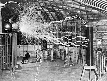 Nikola Tesla, with his equipment