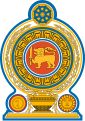 Coat of arms of Sri Lanka, showing a lion holding a sword in its right forepaw surrounded by a ring made from blue lotus petals which is placed on top of a grain vase sprouting rice grains to encircle it. A Dharmacakra is on the top while a sun and moon are at the bottom on each side of the vase.