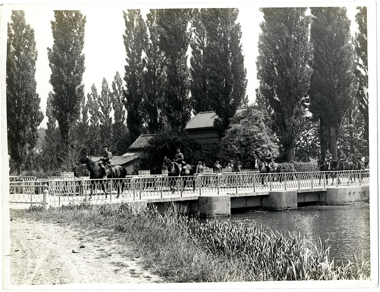 File:Field Artillery marching over a bridge (St Floris, France). Photographer- H. D. Girdwood. (13874325075).jpg