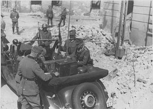 IPN copy #41 The radio car of the command post Stroop near command car, probably at Zamenhofa 48 near intersection with Miła.