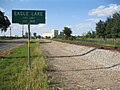 City limit sign with Eagle Lake Rice Dryer in the background