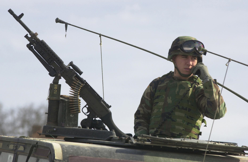 File:B020311f - SPC Gruda responds to call while manning M240B.png