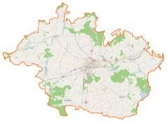 Mapa konturowa powiatu gnieźnieńskiego, w centrum znajduje się punkt z opisem „Pomnik Bolesława Chrobrego”