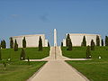 A general view of the memorial, which commemorates service men and women killed since 1945. The two curved walls and two straight walls are made from bricks covered with Portland stone panels. At the centre of the Memorial are two bronze sculptures created by Ian Rank-Broadley. This memorial remembers over 16,000 people who have been killed or sacrificed their lives while on duty or targeted by terrorists or who died in operational theatres. Their names have been written in a panel to signify their significance in the Armed Forces.