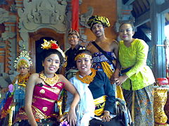 A family of Balinese wearing traditional clothes