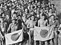 Image 61Australian soldiers display Japanese flags they captured at Kaiapit, New Guinea in 1943 (from History of the Australian Army)