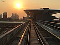 Tren arah Sungai Buloh menghampiri stesen pada waktu petang.