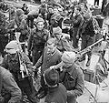 A German prisoner, Unteroffizier Leo Marsiniak, being escorted at Newhaven. He was captured at the gun battery at Varengeville by No. 4 Commando.