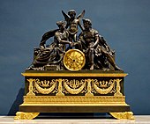 Ceas care îi înfătișează pe Marte și Venus, o alegorie a nunții lui Napoleon cu Marie Louise din 1810; de faimosul bronzier Pierre-Philippe Thomire; circa 1810; bronz aurit (bronz doré) sau patinat; înălțime: 90 cm; Luvru