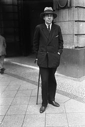 Black and white photo of a man in formal dress