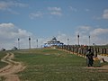 Elaborate ovoo with prayer wheels leading to it in Hohhot, Inner Mongolia, China