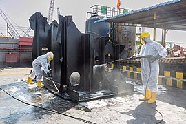 Cleaning of oil stained sections of recycled ship.jpg