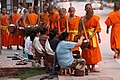 Image 15Monks gathering morning alms (from Culture of Laos)