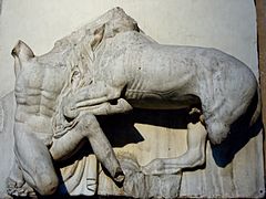 Sculpture of a man fighting a centaur.