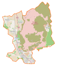 Mapa konturowa gminy Suchy Las, blisko centrum na lewo u góry znajduje się punkt z opisem „Kościół Wszystkich Świętych w Chludowie”