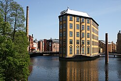 The Strykjärnet (Clothes Iron) building on the Motala River with the Museum of Work