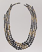 Necklace beads; 2600–2500 BC; gold and lapis lazuli; length: 54 cm; Metropolitan Museum of Art