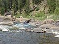 Canoeing is a popular river sport.