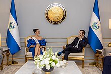 R'Bonney Gabriel and Nayib Bukele sitting in chairs, facing each other