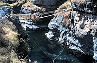 Lashing the hand-ropes to the main side cables.