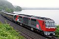 A Cassiopeia cruise train hauled by JR Freight Class DF200 diesel locomotive DF200-61 in Hokkaido in July 2016